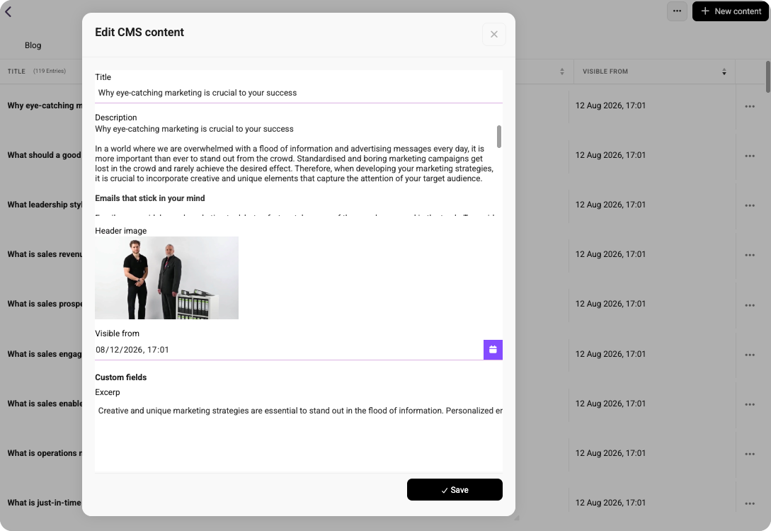 CMS content editor with a blog post title, description, excerpt, and header image preview showing two people standing beside a cabinet.
