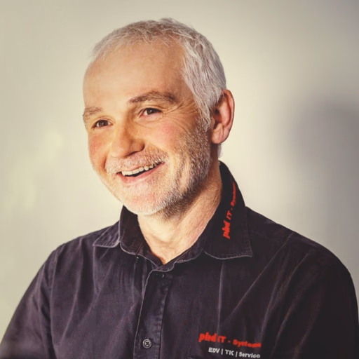 Portrait of a smiling customer testimonial speaker in a black shirt.